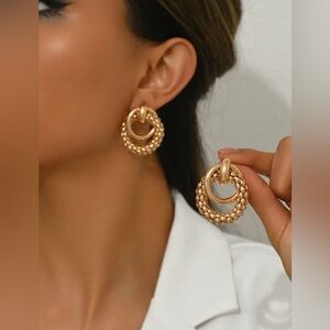 Gold c-shaped spiral twisted geometric boho pattern earrings